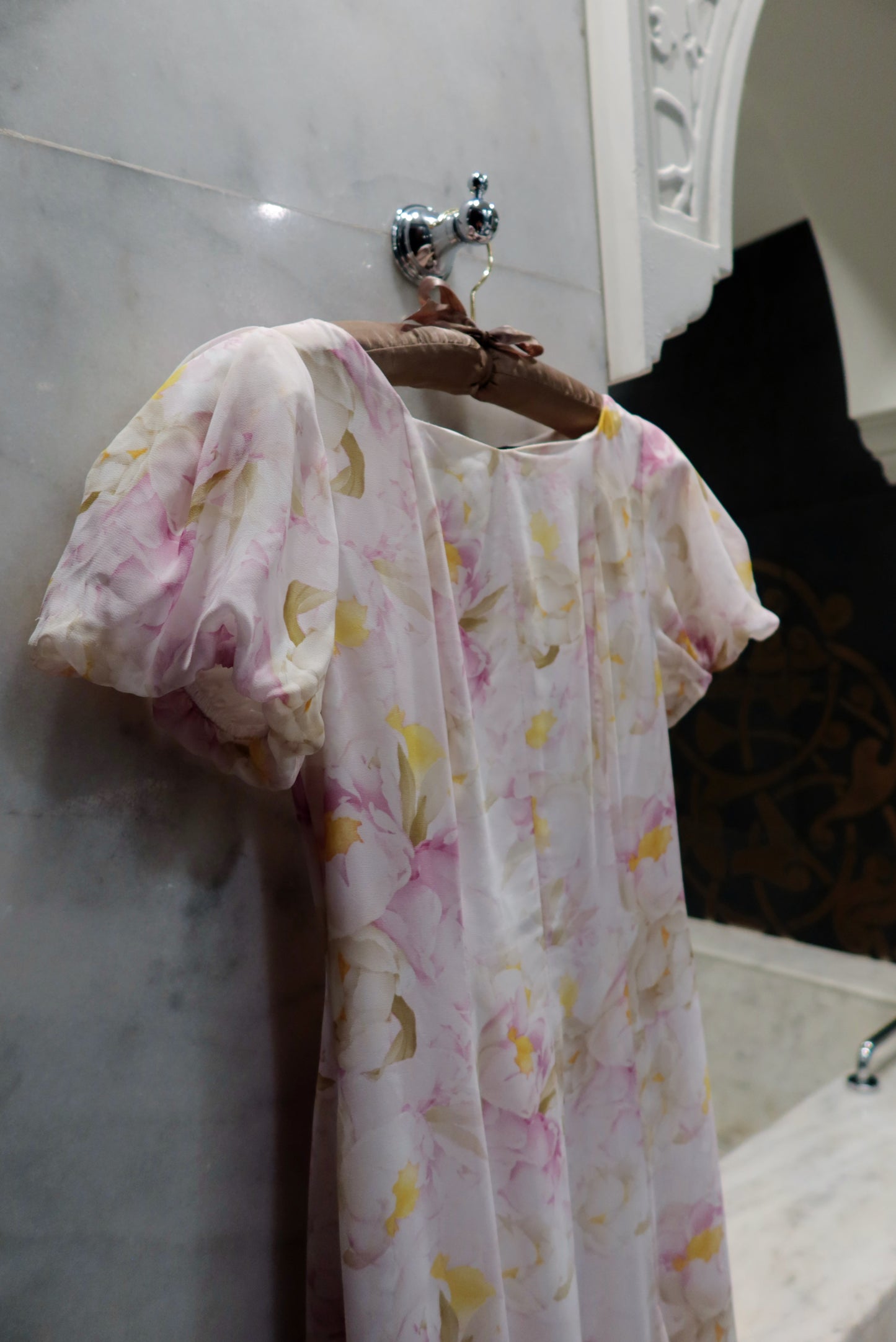 Fioraè floral chiffon fabric detail showing lightweight printed material and puff sleeves