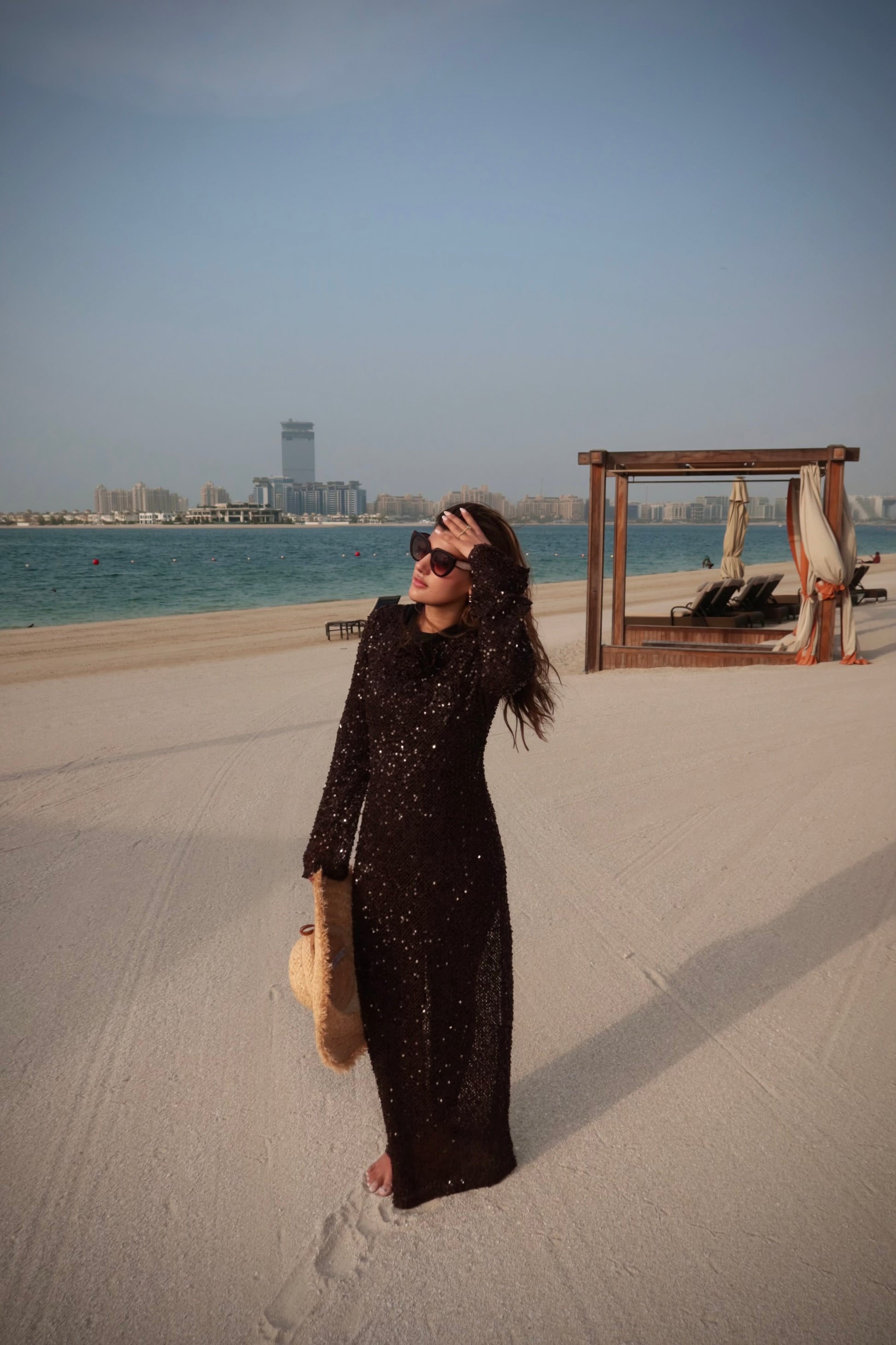 Vierra brown sequin crochet dress styled over swimwear.