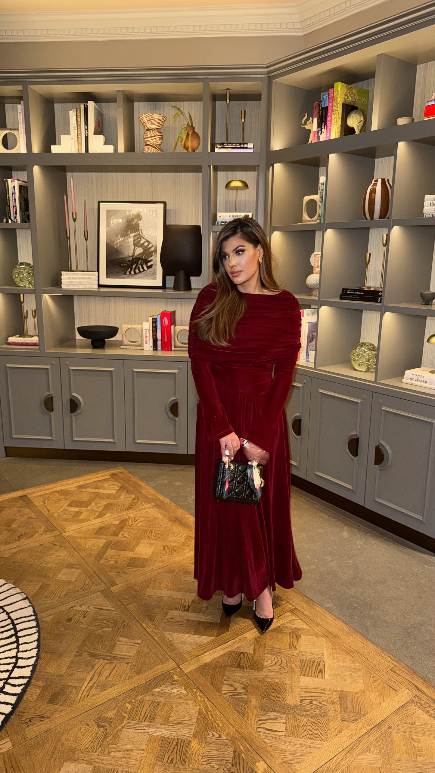 Lunara modest red velvet formal dress with draped neckline.